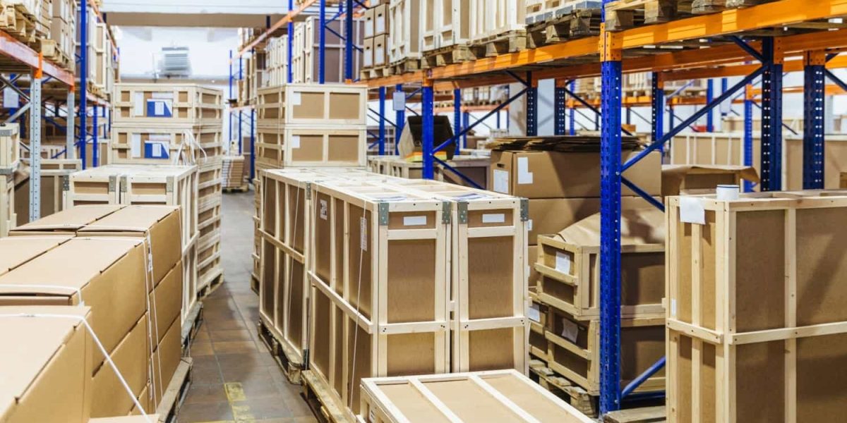 "Rows of shelves filled with stock – Trusted UK wholesale supplier for Amazon FBA and retail businesses."